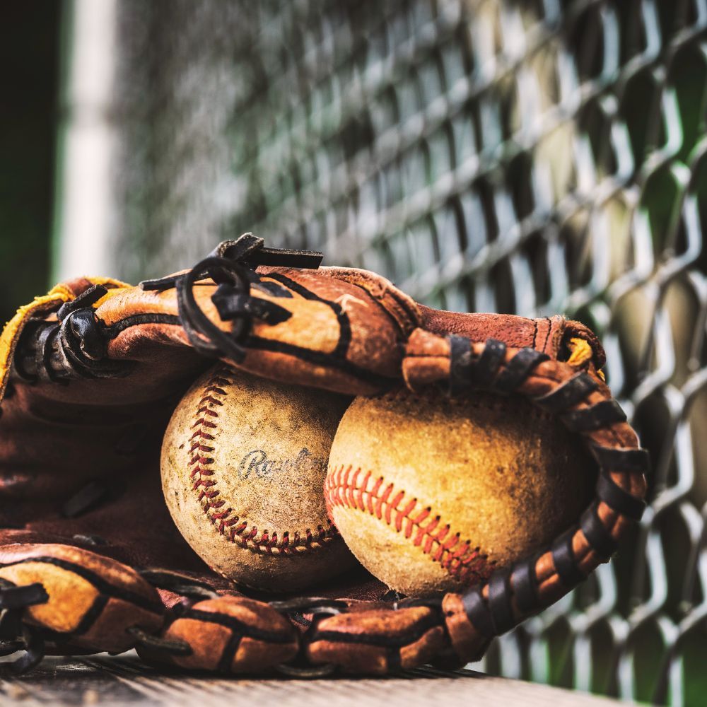 A picture of a person caring for a baseball glove